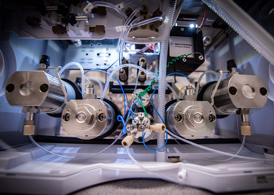 Close-up of an experimental setup with cables and tubes.